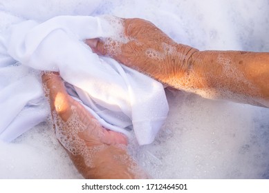 Hands Of Old Woman Doing Laundry Outdoor