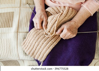 Hands Of Old Woman Knitting Needles Warm Woolen Scarf