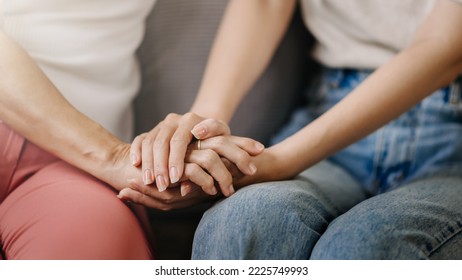 Hands of the old woman and a wman hand in home - Shutterstock ID 2225749993