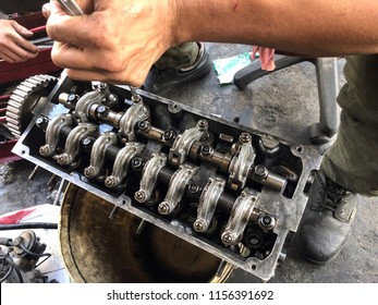 Hands on Car Engine Block petrol gasoline cylinder cam shaft spring rocker arm valve Repair refurbish 
