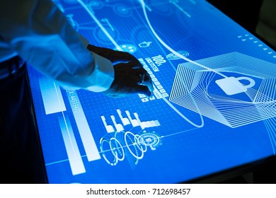 Hands on cyber space table typing - Shutterstock ID 712698457