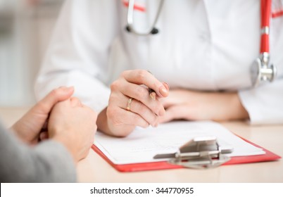 Hands On Desk Of Doctor Woman And Her Patient 