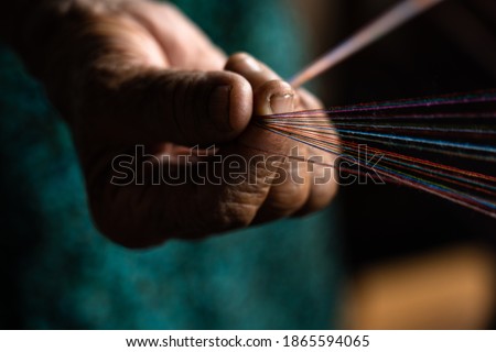 hands on a loom with thread Photo stock © 