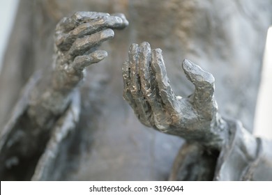 Hands on a statue