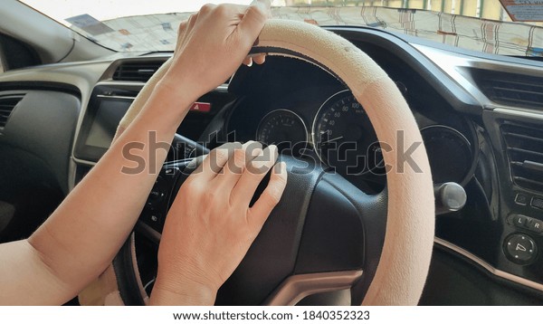 Hands on the steering\
wheel.
