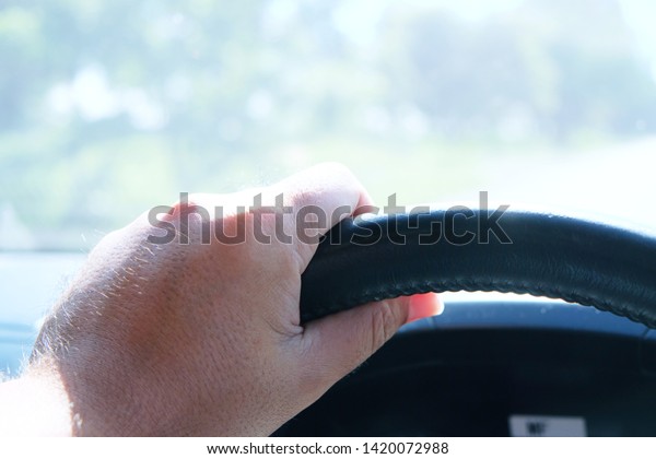 Hands on\
steering wheel during car while\
driving