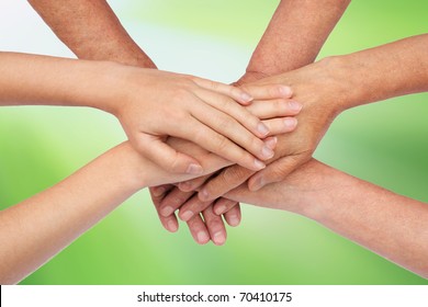 Hands on top of each other green