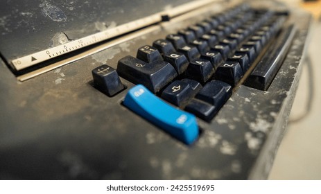 hands on typing machine typewriter old and very used.