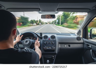 Hands on the wheel when driving at high speed from inside the car. - Shutterstock ID 2200725217