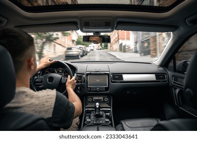 Hands on the wheel when driving at high speed from inside the car. - Shutterstock ID 2333043641