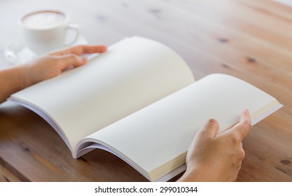 Hands Open Blank Catalog, Magazines,book Mock Up On Wood Table With Coffee