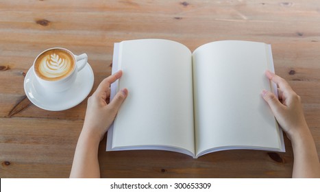 Hands Open Blank Catalog, Magazines,book Mock Up On Wood Table With Coffee