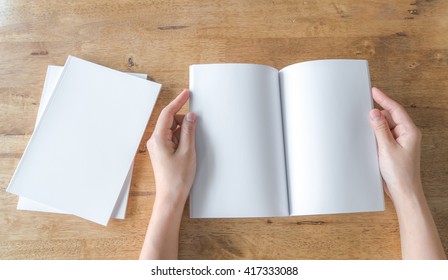 Hands Open Blank Catalog, Magazines,book Mock Up On Wood Table