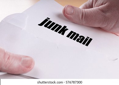 Hands Opening Junk Mail Or Direct Mailing Letter