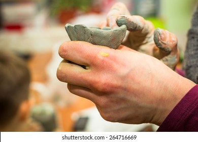 Hands Painter And Sculptor Stained With Clay And Paint. Children's Creativity And A Hobby For Adults. Modeling. 