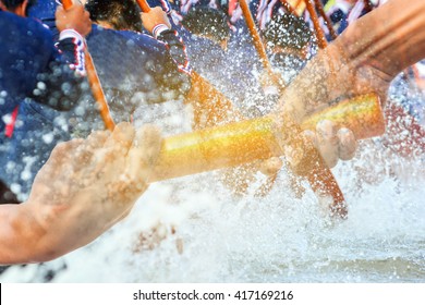 hands passing a relay baton on rowing team background - Shutterstock ID 417169216