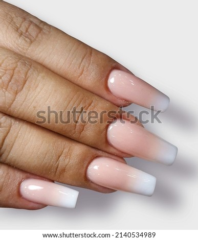 Hands with pastel pink acrylic nails manicure and paint isolated on white background