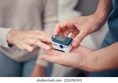 Hands, patient and finger pulse with nurse to monitor oxygen, rate and health at home. Closeup hand of caregiver helping elderly person in oximetry healthcare to check pulses or monitoring breathing - Powered by Shutterstock