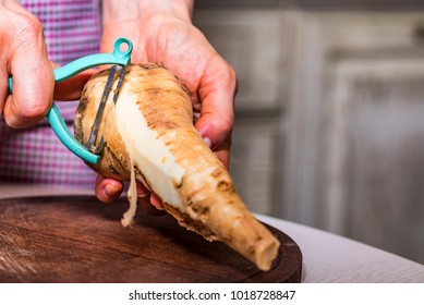 Hands Peeling Parsnip Close