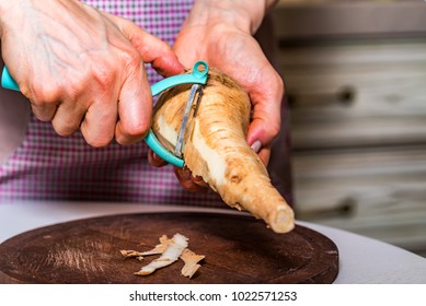 Hands Peeling Parsnip Close