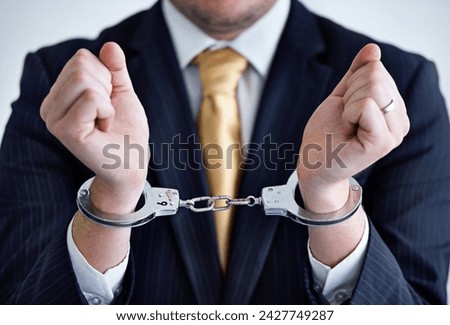 Hands, person in corporate and handcuffs for fraud or bribery, business deal gone wrong with justice or jail. Professional crime, corruption or money laundering, shackles for prison with criminal