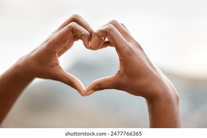 Hands, person and outdoor with heart sign, symbol and start morning with kindness, gratitude and nature. Love, shape and icon with care, emoji and romance on holiday at sunrise in Rio de Janeiro - Powered by Shutterstock