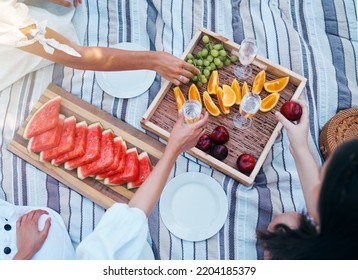 Hands, Picnic And Fruits Of Friends With Wine At Park Eating And Drink Luxury, Nutrition And Grape Celebration Champagne In Summer. Women, Family Or People Celebrate With Healthy Diet Food Top View