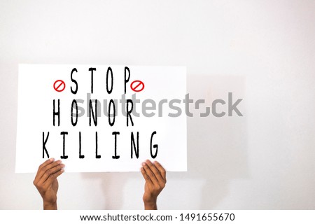 Hands with Placard showing the Stop Honor Killing on isolated background