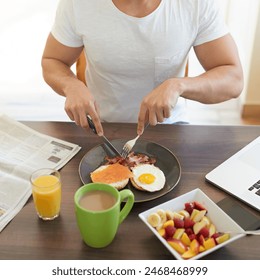 Hands, plate and eating breakfast in home with eggs, bread and bacon for wellness with diet. Person, knife and fork for food, natural protein and coffee in dining room, start or morning at apartment - Powered by Shutterstock