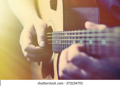 Hands Playing Acoustic Guitar, Close Up