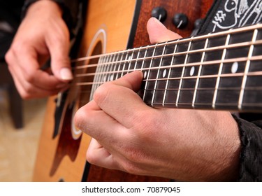 Hands Playing Guitar In Diagonal Position