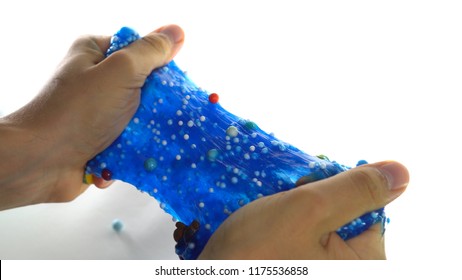 Hands Playing With Toy Called Slime, Isolated on Withe Background