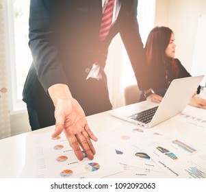 Hands pointing on data chart sheet for business meeting