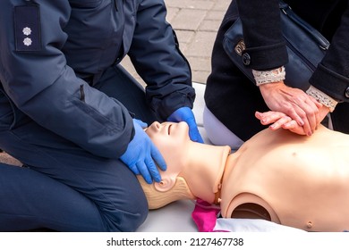 Hands Of A Policeman On A Mannequin During An Exercise Of Resuscitation. CPR First Aid Training Concept.Urgent Care.