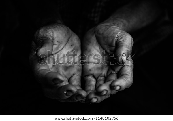hands poor\
old man or beggar begging you for help sitting at dirty slum.\
concept for poverty or hunger people,human Rights,donate and\
charity,background text.black and white\
tone