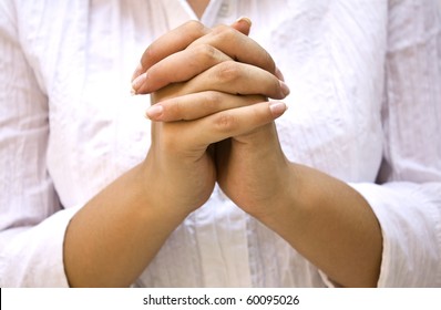 Hands Positioned as in Prayer isolated on white