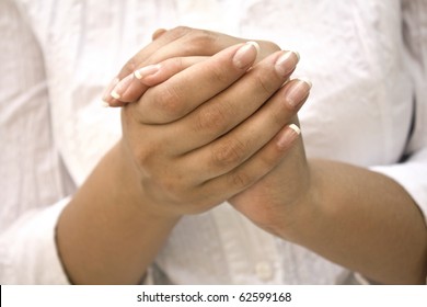 Hands Positioned as in Prayer isolated on white