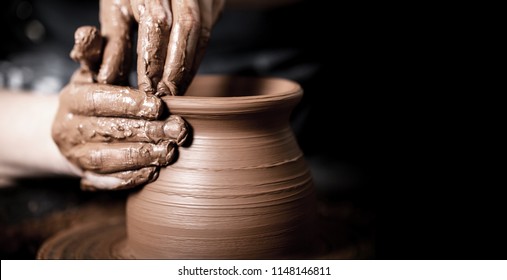 Hands Of Potter Making Clay Pot