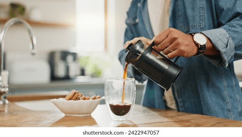 Hands, pouring coffee and breakfast in home kitchen, energy and start morning with warm matcha at table. Man, filter kettle and french press plunger for fresh organic caffeine at house for hot drink - Powered by Shutterstock