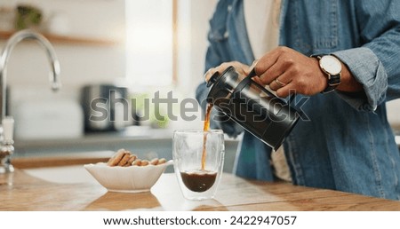 Similar – Image, Stock Photo Pouring coffee from a french press into a white cup, in front of a glass background and a stripped placemat