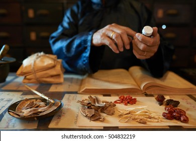 Hands of practitioner making remedy for his patient - Shutterstock ID 504832219