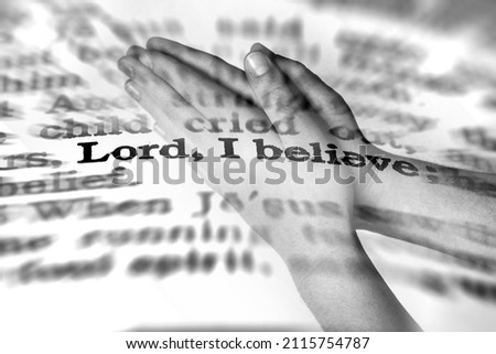 Hands praying with faith scripture in background about Lord I believe