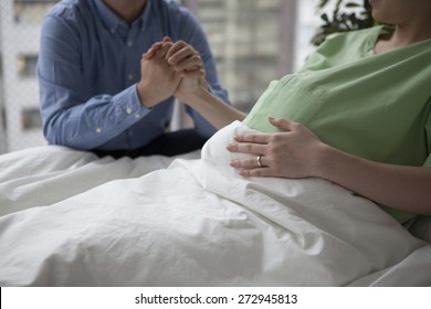 Hands of pregnant woman and her husband - Shutterstock ID 272945813