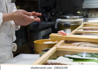 Hands preparing sushi on a Japanese restaurant. - Shutterstock ID 238101190