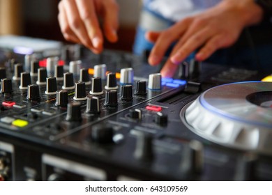 The Hands Of A Professional DJ Set Up The Dj's Panel With A Many Buttons And Control Knobs To Play Music