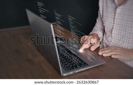 Hands of a programmer types on a laptop displaying programming code, symbolizing coding tech, software development, web applications. IT solutions, and digital technology