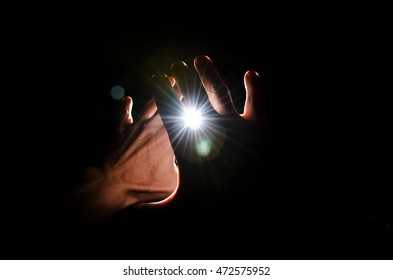 Hands protect against very bright flash of light.