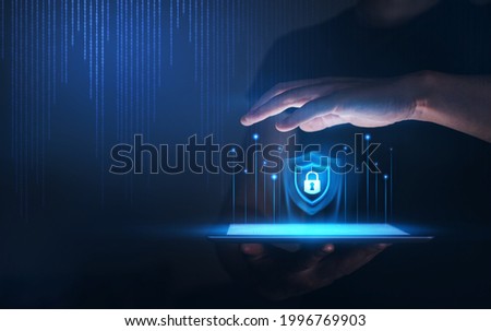 Hands protecting Personal  Data information on Tablet. 
Internet Technology. Information and cyber security  Technology Services concept. 
