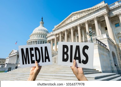 Hands Of Protestors Holding Up Signs Calling Attention To Media Bias In Washington, DC, USA