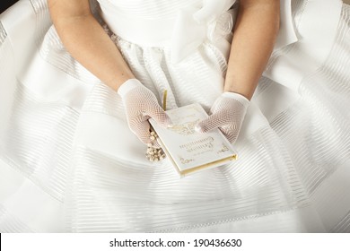 hands of prying girl going to the first holy communion